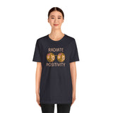 Unisex Radiate Positivity Premium Soft Tee featuring floral glasses design, perfect for spreading kindness and good vibes.