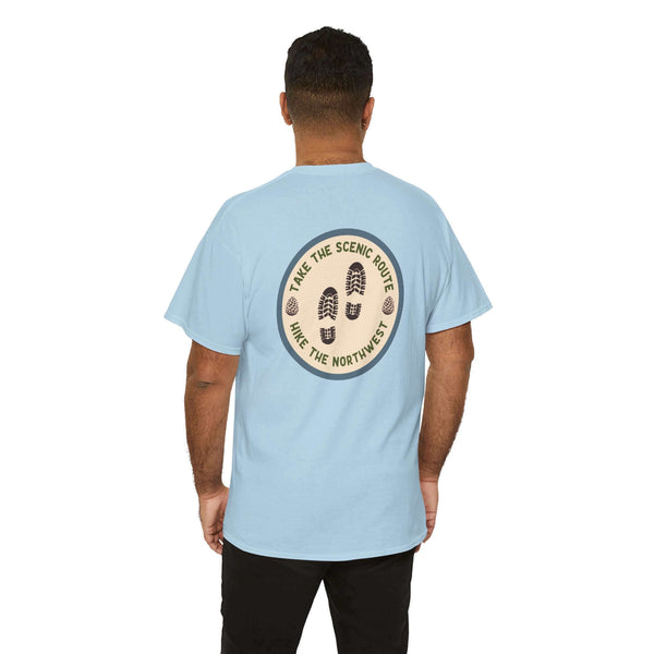 "Man wearing 'Take the Scenic Route' hiking tee with Pacific Northwest trail design on back"