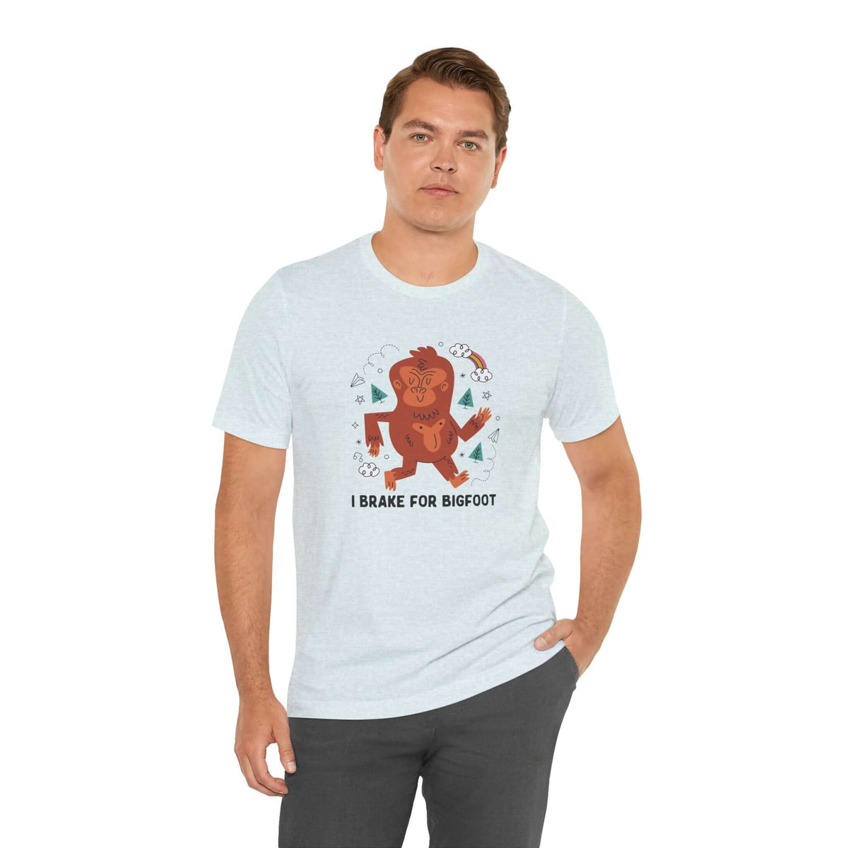 Man wearing 'I Brake for Bigfoot' premium soft tee featuring a whimsical Sasquatch graphic.