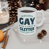 Being Gay Is Like Glitter It Never Goes Away Mug on a cozy table setting with coffee and decorations.