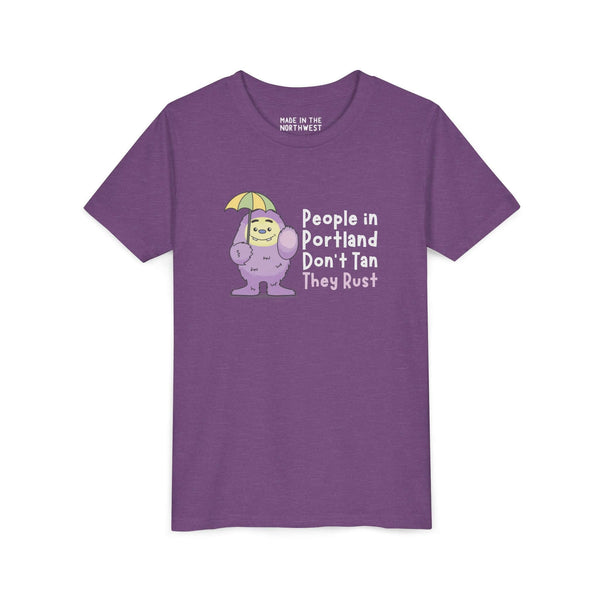 Portland Soggy Monster Kids Tee featuring Purple People Eater with umbrella, playful design for PNW natives.