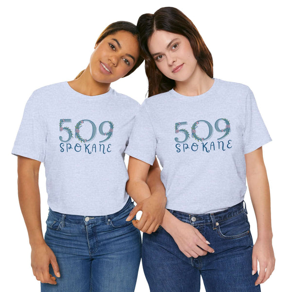 Two women wearing 509 Floral Area Code Soft Tee showcasing Spokane pride and style, perfect for casual outings.