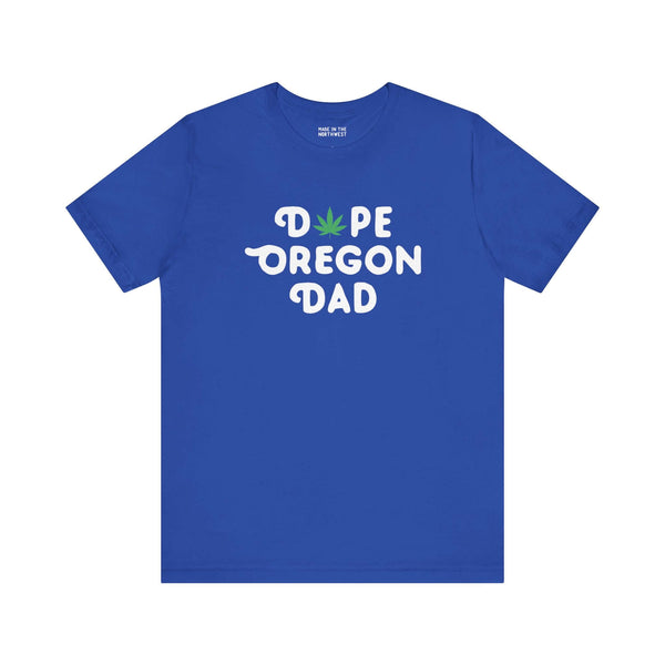 Blue "Dope Oregon Dad" tee with marijuana leaf replacing 'O,' showcasing playful Oregon pride for laid-back dads.