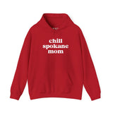 Red hoodie featuring the text 'chill spokane mom' for relaxed outdoor adventures and lifestyle.