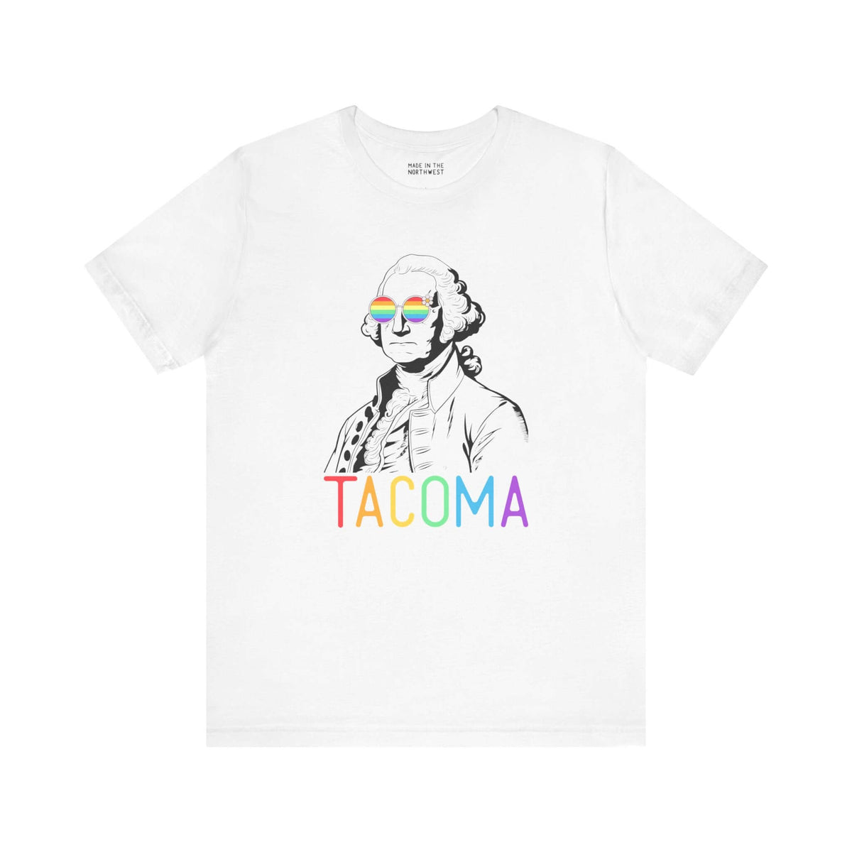 White tee featuring George Washington with rainbow glasses and "Tacoma" in rainbow letters, celebrating Pride and inclusivity.