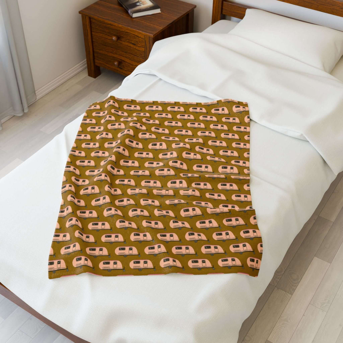 Tiny Trailer Travels RV Lightweight Cozy Blanket on a bed, featuring classic travel trailers pattern for comfort.
