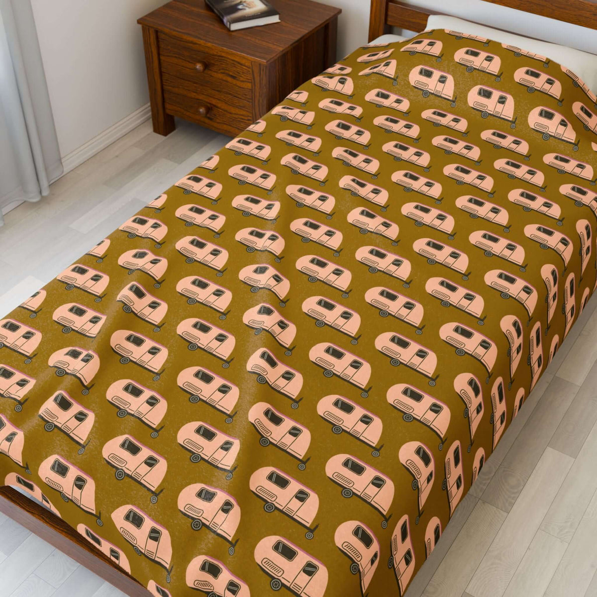 Tiny Trailer Travels RV Lightweight Cozy Blanket featuring a charming travel trailer pattern on a cozy bed.