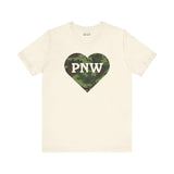 Camouflage PNW Heart Soft Tee showcasing Pacific Northwest pride with a camo heart design on a beige shirt.