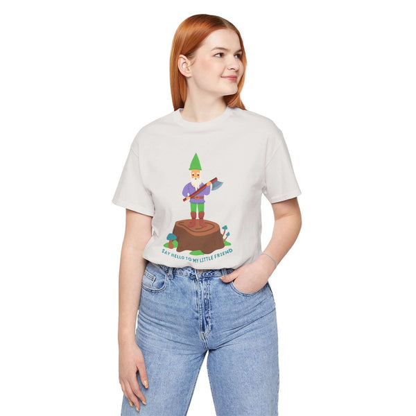 Woman wearing 'Say Hello to My Little Friend' soft tee featuring a gnome with an axe on a stump.