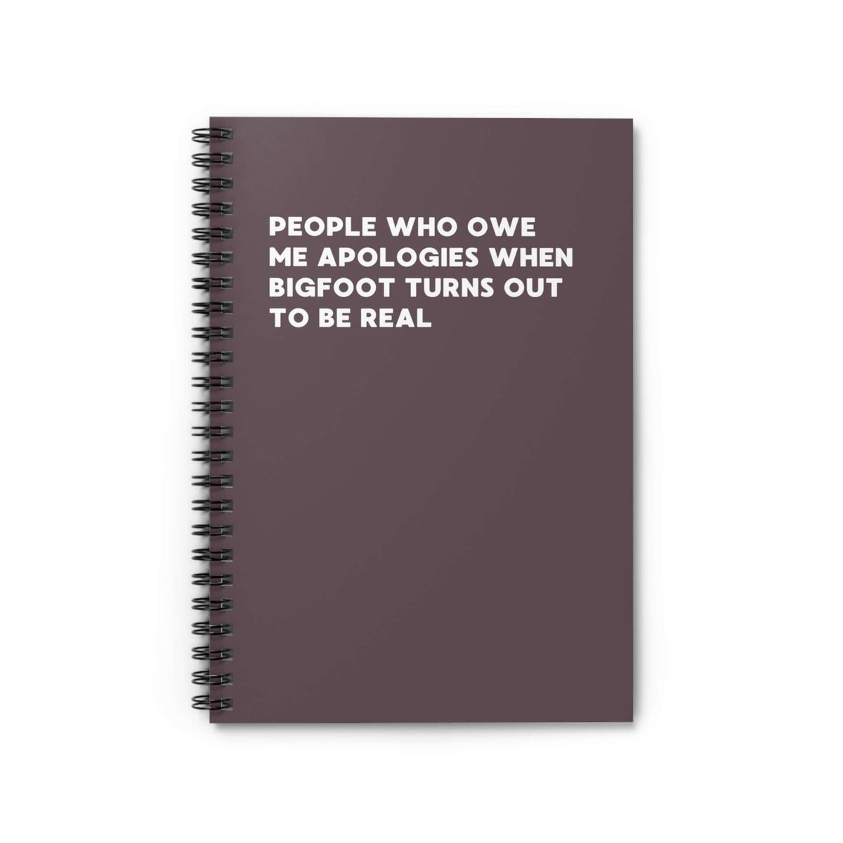 Spiral notebook featuring humorous text about Bigfoot and apologies from skeptics.