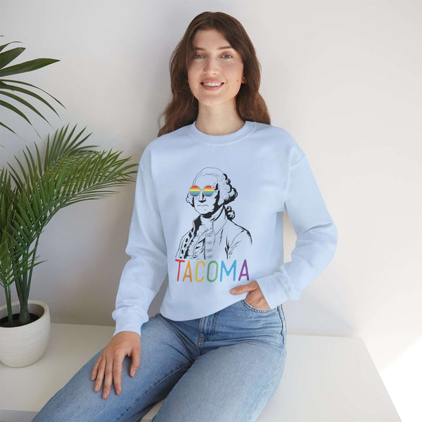 Woman wearing "George's Rainbow Vision Tacoma" sweatshirt with rainbow-lettered "Tacoma" and George Washington design.