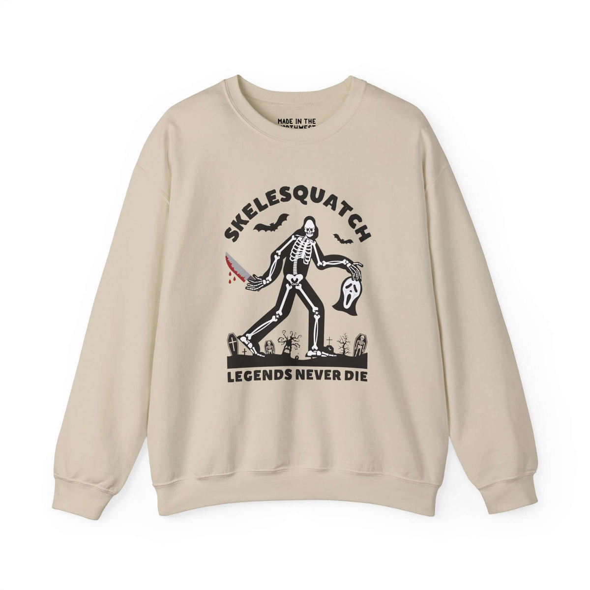 Skelesquatch Halloween sweatshirt featuring a skeleton sasquatch with a bloody knife and Scream mask in a graveyard.