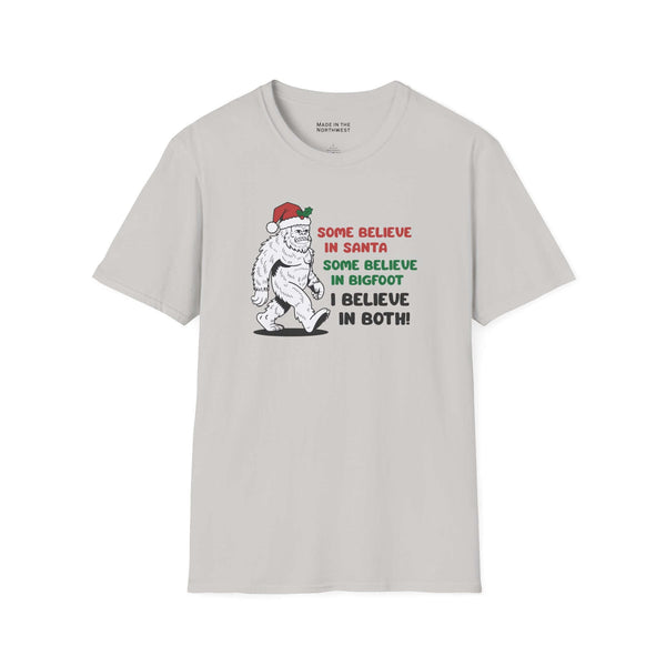 Believe in Santa and Bigfoot tee featuring a cheerful Bigfoot in a Santa hat with humorous text.