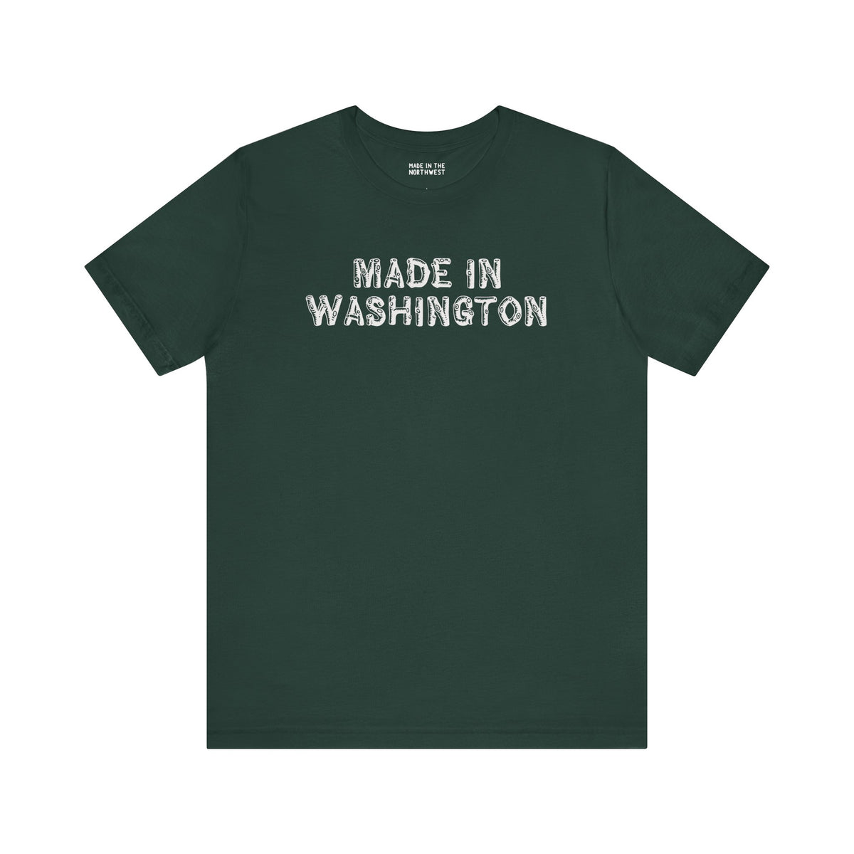 Dark green tee featuring bold 'Made in Washington' lettering in a wood log font, celebrating Pacific Northwest pride.