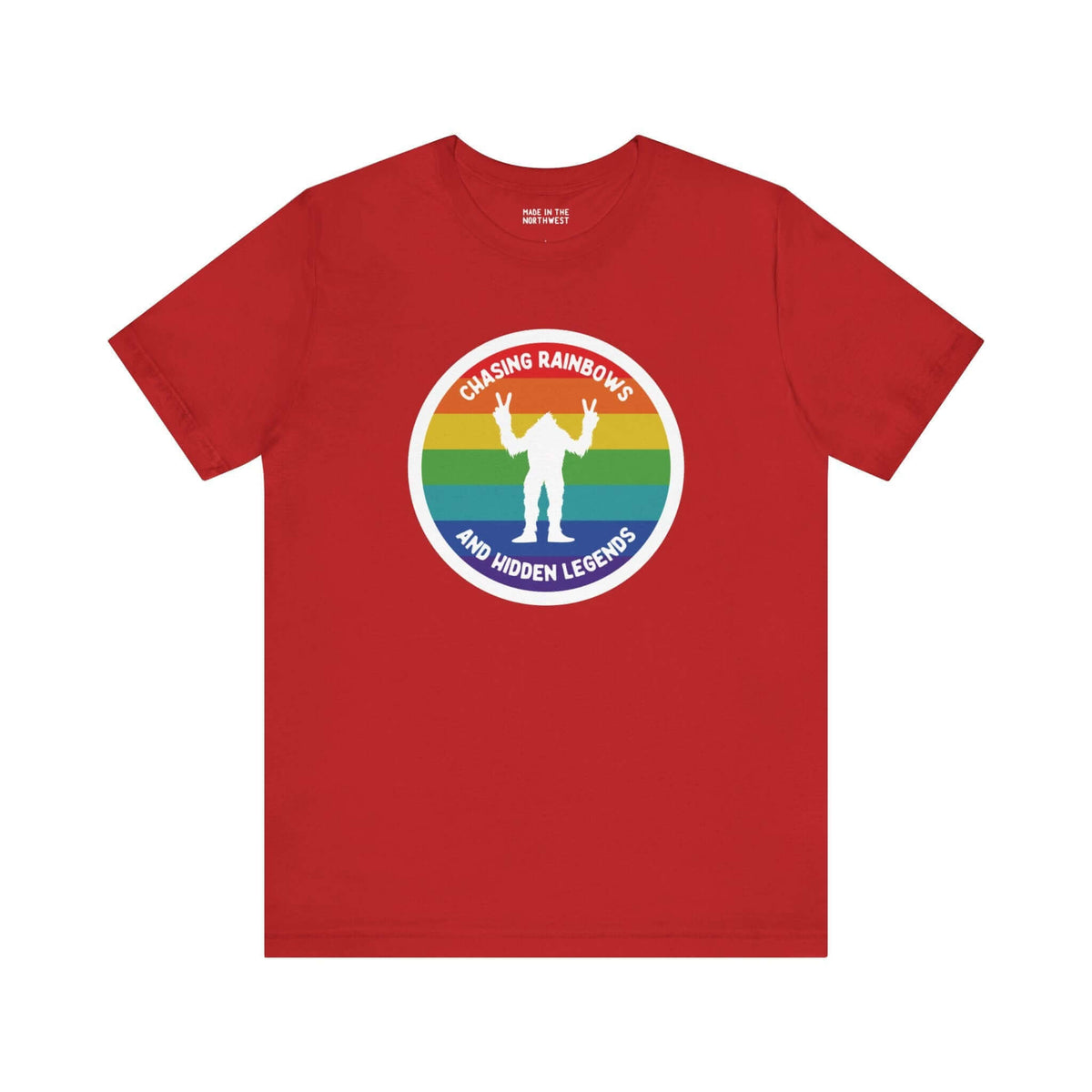 Chasing Rainbows Sasquatch Soft Tee Celebrate your roots with a splash of color and a touch of mystery in our "Hometown Pride" tee. Featuring a vibrant rainbow circle and a playful Sasquatch graphic, this shirt embodies the unique and spirited vibe of the