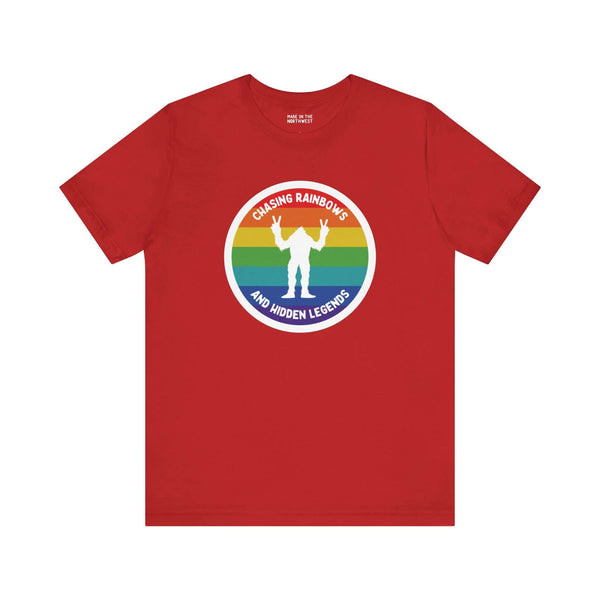 Chasing Rainbows Sasquatch Soft Tee Celebrate your roots with a splash of color and a touch of mystery in our "Hometown Pride" tee. Featuring a vibrant rainbow circle and a playful Sasquatch graphic, this shirt embodies the unique and spirited vibe of the