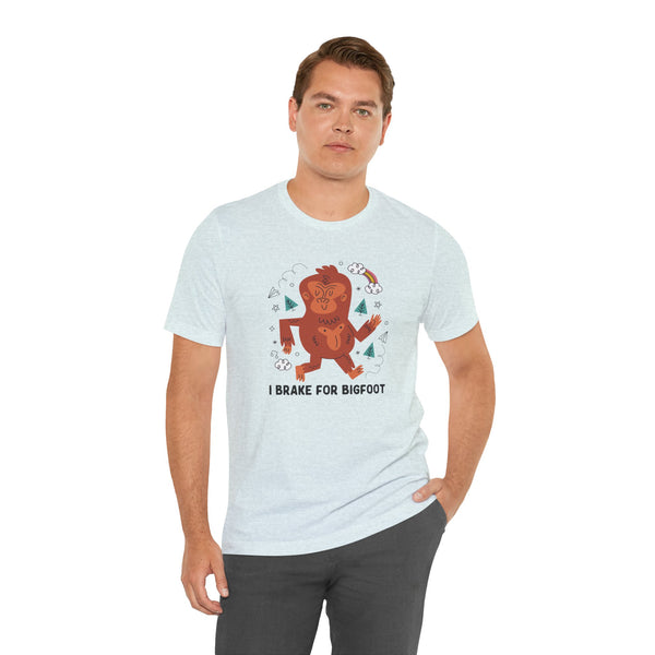 Man wearing I Brake for Bigfoot tee featuring a playful Sasquatch graphic and fun folklore design.