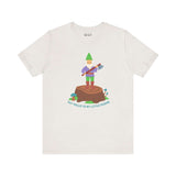 Say Hello to My Little Friend Soft Tee featuring a gnome with an axe on a stump, playful and humorous design.
