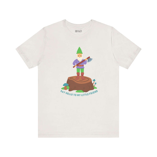 Say Hello to My Little Friend Soft Tee featuring a gnome with an axe on a stump, playful and humorous design.