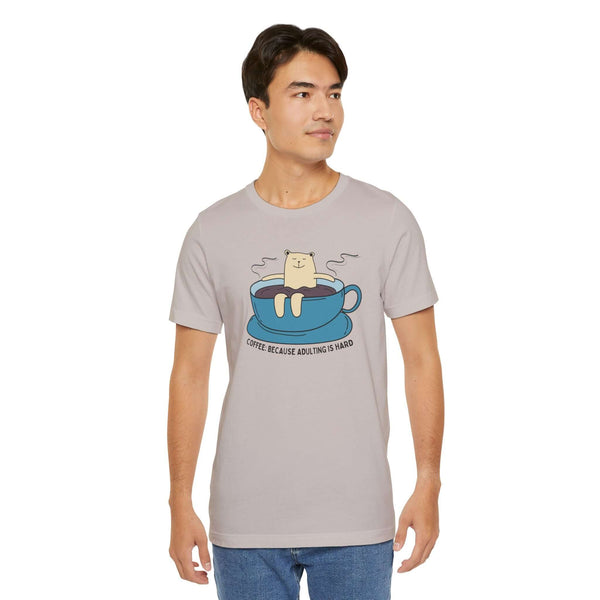 Man wearing Coffee Because Adulting is Hard premium soft tee with a cute bear in a coffee cup design.