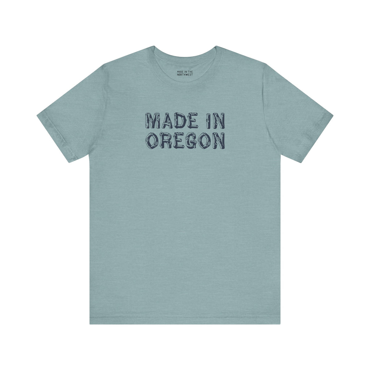 Premium soft tee featuring rustic 'Made in Oregon' log font on a blue-green background, perfect for outdoor enthusiasts.