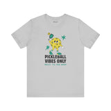 Pickleball Vibes Only T Shirt featuring a retro pickleball character with a paddle and vibrant design.