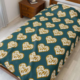 Oregon State of Mind Heart Lightweight Cozy Blanket with repeating heart pattern on a bed.