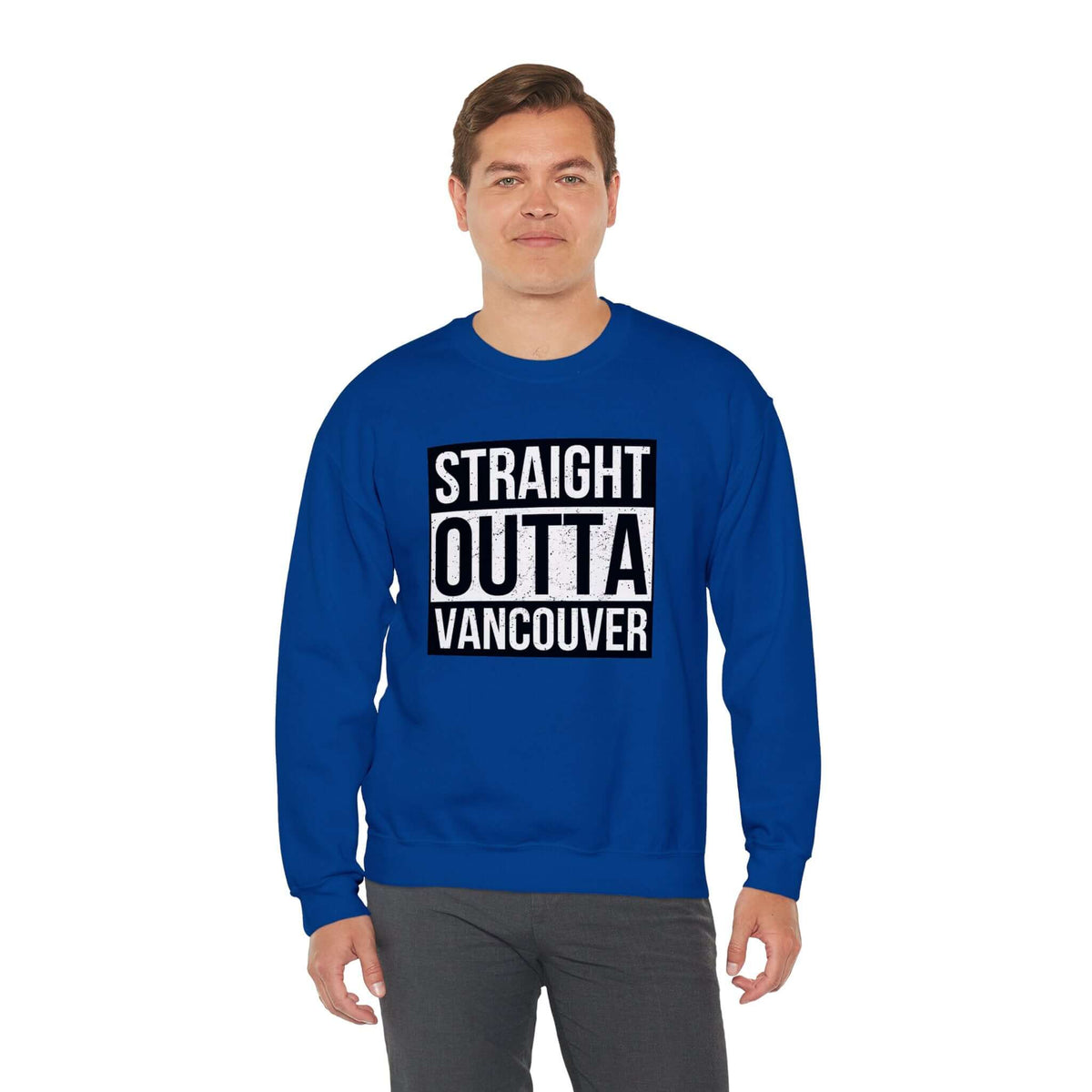 Man wearing "Straight Outta Vancouver" blue sweatshirt, streetwear style, showcasing city pride.