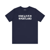 Home Is in Portland Tee – Rose City Pride Shirt featuring text and illustrations on navy blue fabric.