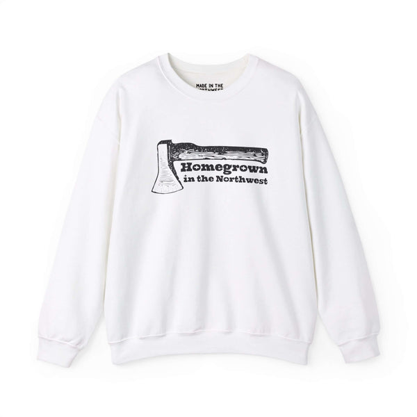 White sweatshirt featuring "Homegrown in the Northwest" with a rugged axe design celebrating Pacific Northwest spirit.