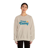 Model wearing 'Feelin' Couvey' retro sweatshirt showcasing vibrant design and cheerful colors.