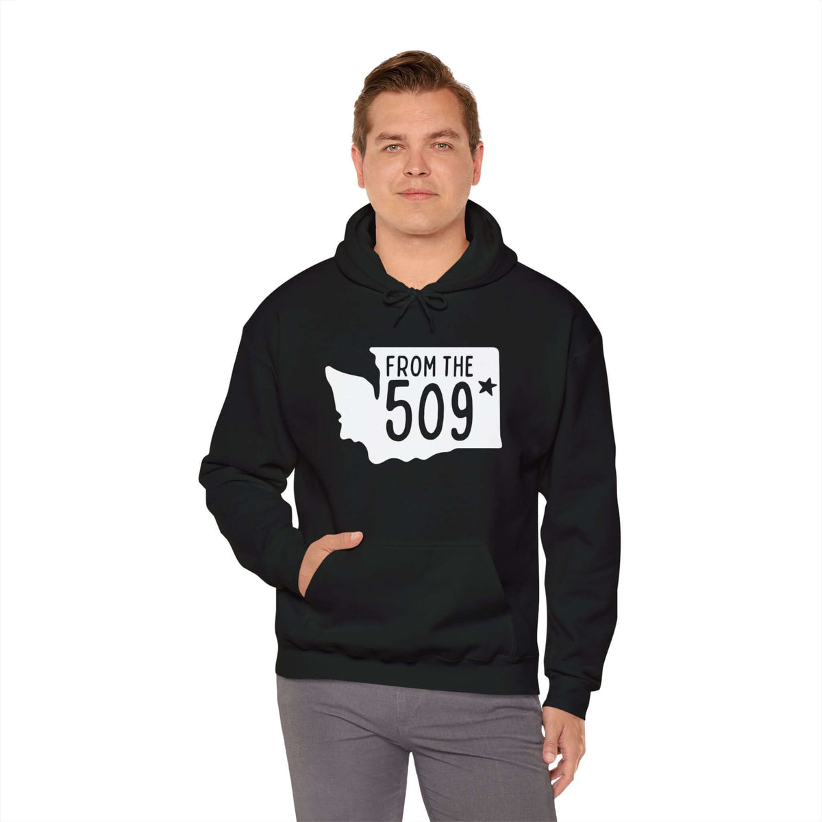 Man wearing "From the 509" hoodie with Washington state silhouette and Spokane star, showcasing local pride and area code representation.