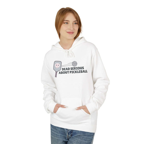 Woman wearing Dead Serious About Pickleball Hoodie with a skull-decorated paddle graphic.