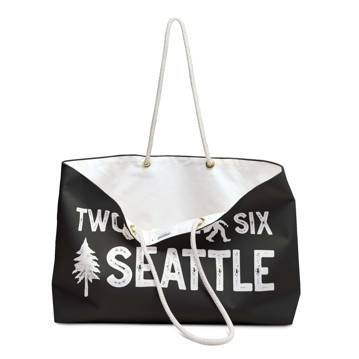Two Oh Six Roots Seattle Adventure Weekender Bag with rope handles and tree design, perfect for weekend trips.