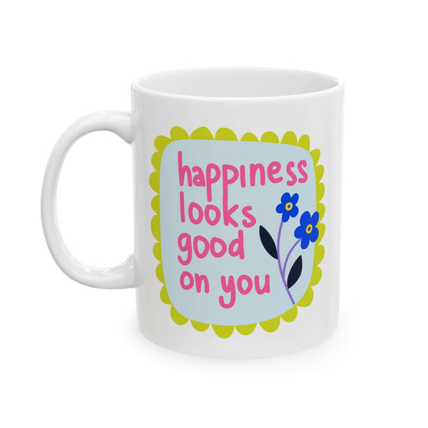 Happiness Looks Good On You Mug featuring a cheerful floral design and playful typography on a glossy white ceramic.