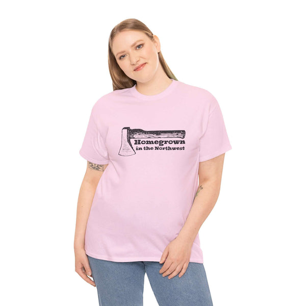 Woman wearing pink "Homegrown in the Northwest" tee with axe graphic, symbolizing Pacific Northwest pride and rugged spirit.