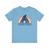 Chasing Rainbows and Sasquatch tee featuring vibrant rainbow graphic, perfect for PNW pride and vintage-inspired style.