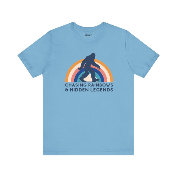 Chasing Rainbows and Sasquatch tee featuring vibrant rainbow graphic, perfect for PNW pride and vintage-inspired style.