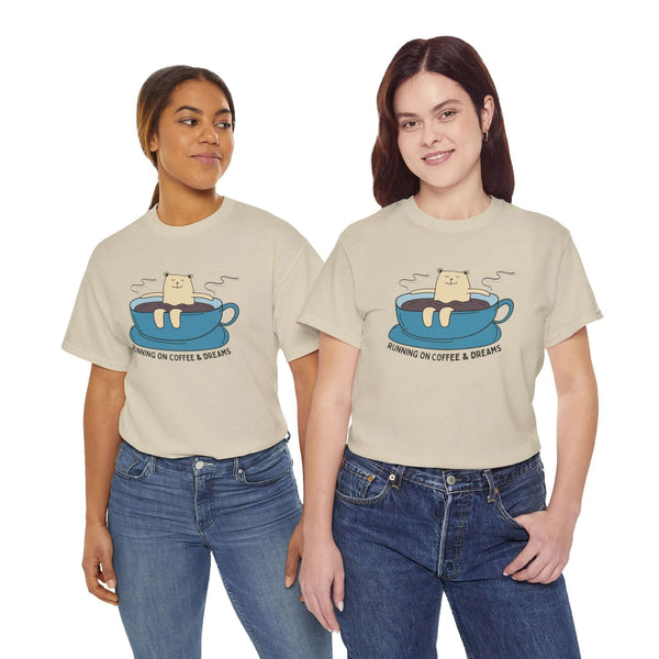 Two women wearing "Running on Coffee and Dreams" athletic tees with a bear in a coffee cup design. Perfect for coffee lovers and adventurers.