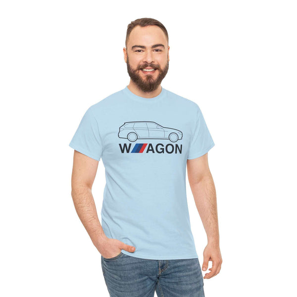 Man wearing a light blue T-shirt with a BMW wagon silhouette and "Wagon Life" design, celebrating automotive style and versatility.