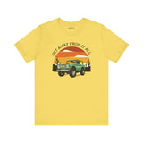 Vintage Bronco graphic tee in yellow, featuring retro adventure vibes and sunset design.