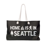 Home is in Seattle weekender bag with rope handles and design featuring a tree and campfire.