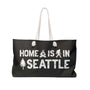Home is in Seattle weekender bag with rope handles and design featuring a tree and campfire.