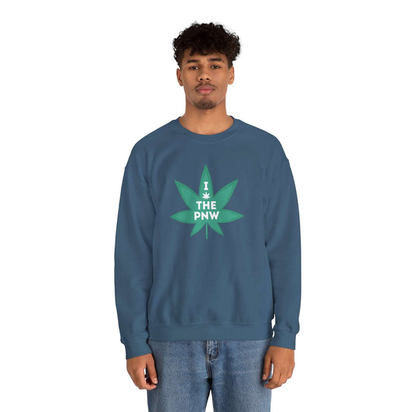 Man wearing a blue sweatshirt with a marijuana leaf graphic that says 'I (Weed) the PNW' in green.