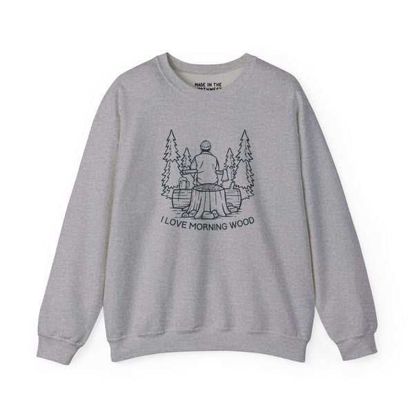 I Love Morning Wood sweatshirt featuring an outdoorsman design sitting on a log in a forest setting.