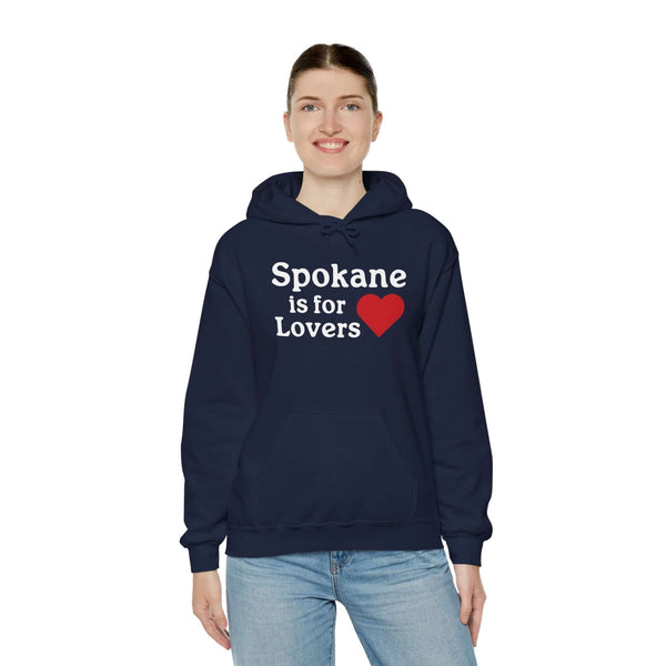 "Woman wearing Spokane is for Lovers hoodie with heart design, showcasing Spokane pride."