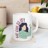We Can Do It Mug featuring a hand-drawn figure with playful lettering on a glossy ceramic surface.