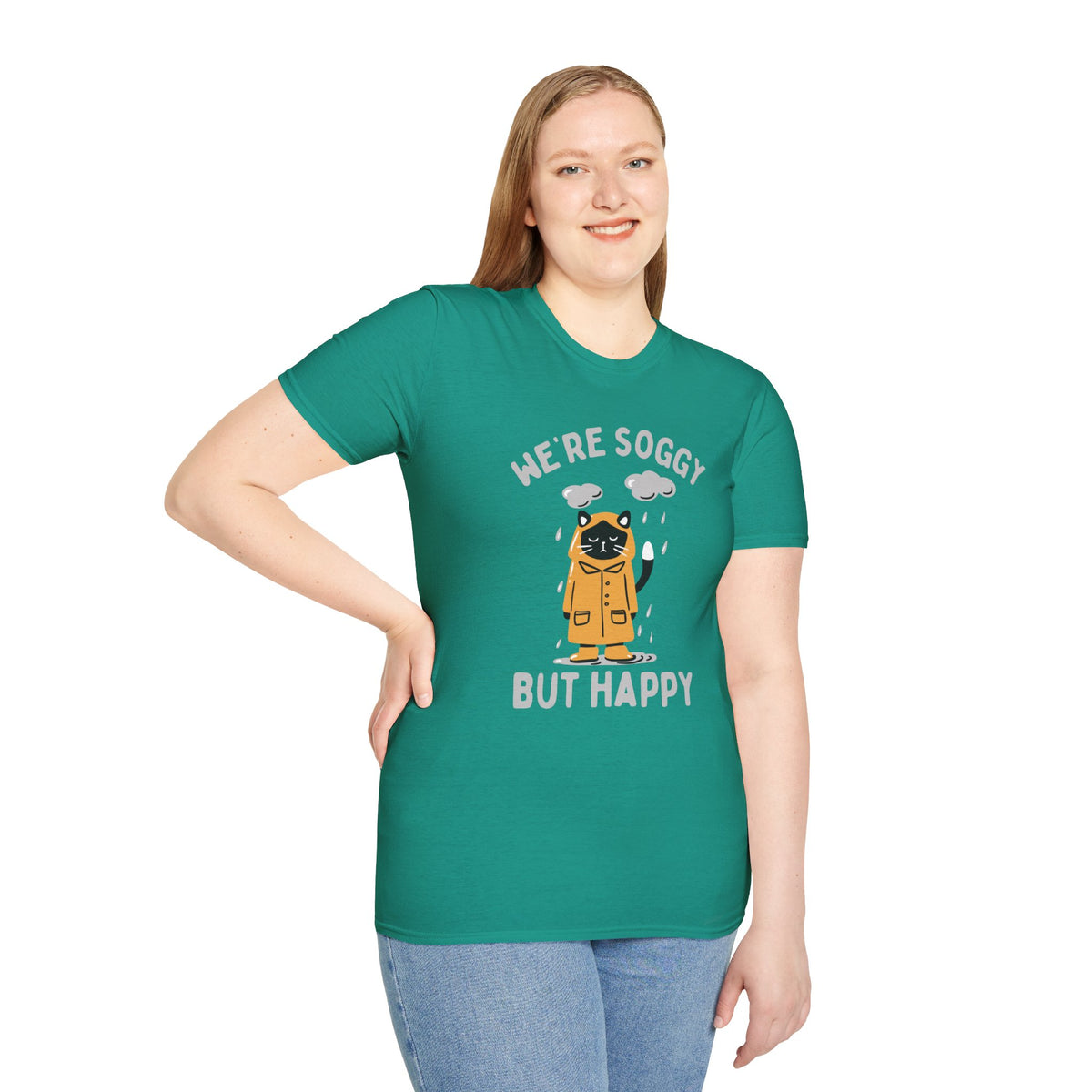 We're Soggy But Happy T-Shirt featuring a drenched cat in a raincoat, perfect for embracing Pacific Northwest charm.