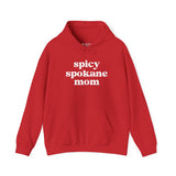 Red cozy hoodie with 'spicy spokane mom' text, perfect for active Spokane moms enjoying local adventures.