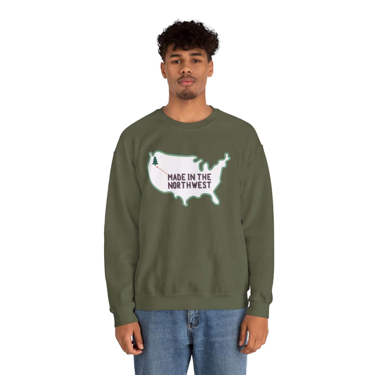 Evergreen is Where It's At Sweatshirt Show your love for the Pacific Northwest with our exclusive "Evergreen is Where it's At" sweatshirt. This design features the woodgrain United States with a tree marking the PNW location, highlighted by an arrow and t